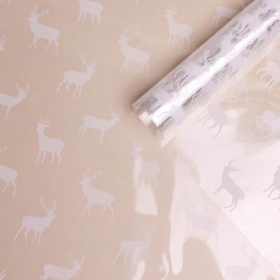 Пленка упаковочная прозрачная с рисунком для цветов и подарков в рулоне Северные олени 70 см Белый