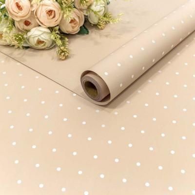 Плёнка флористическая матовая в рулоне 58 см*10 м Мелкий горошек бежево-серый 442520