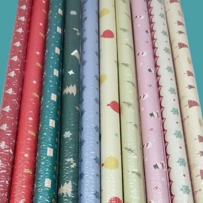 Бумага упаковочная новогодняя глянцевая 70*100 см 10 дизайнов по 5 листов 50 л/уп 536151