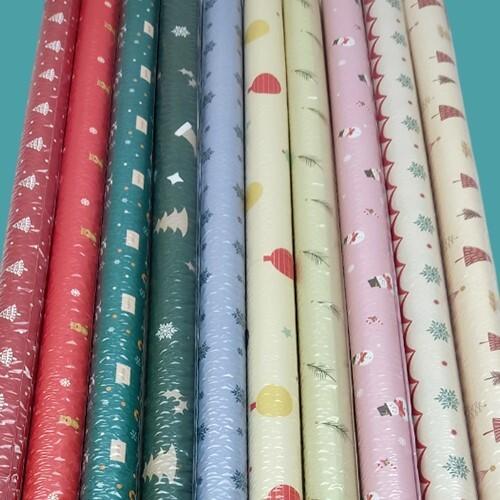 Бумага упаковочная новогодняя глянцевая 70*100 см 10 дизайнов по 5 листов 50 л/уп 536151