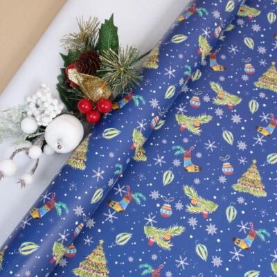 Бумага упаковочная новогодняя глянцевая 70*100 см Елочки на синем 10 л/уп 568036