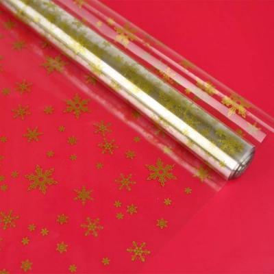 Пленка упаковочная прозрачная с рисунком для цветов и подарков в рулоне Снежинки NEW 70 см Золото